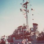 On the left are Sabalo sailors; In the middle Stickleback sailors and the destroyer
  and crew as a backdrop